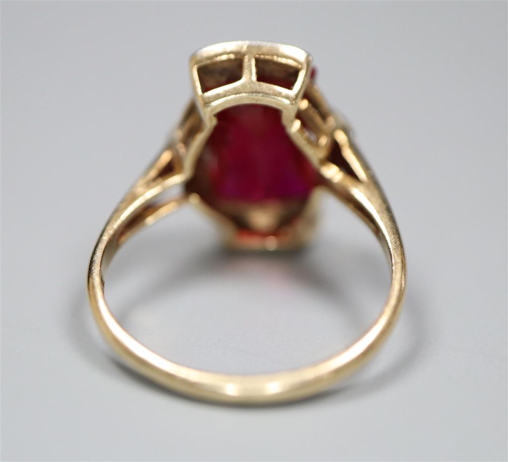 A 1950s? 10k yellow metal and fancy cut synthetic? ruby and diamond chip set dress ring, size L/M, gross 3.5 grams.